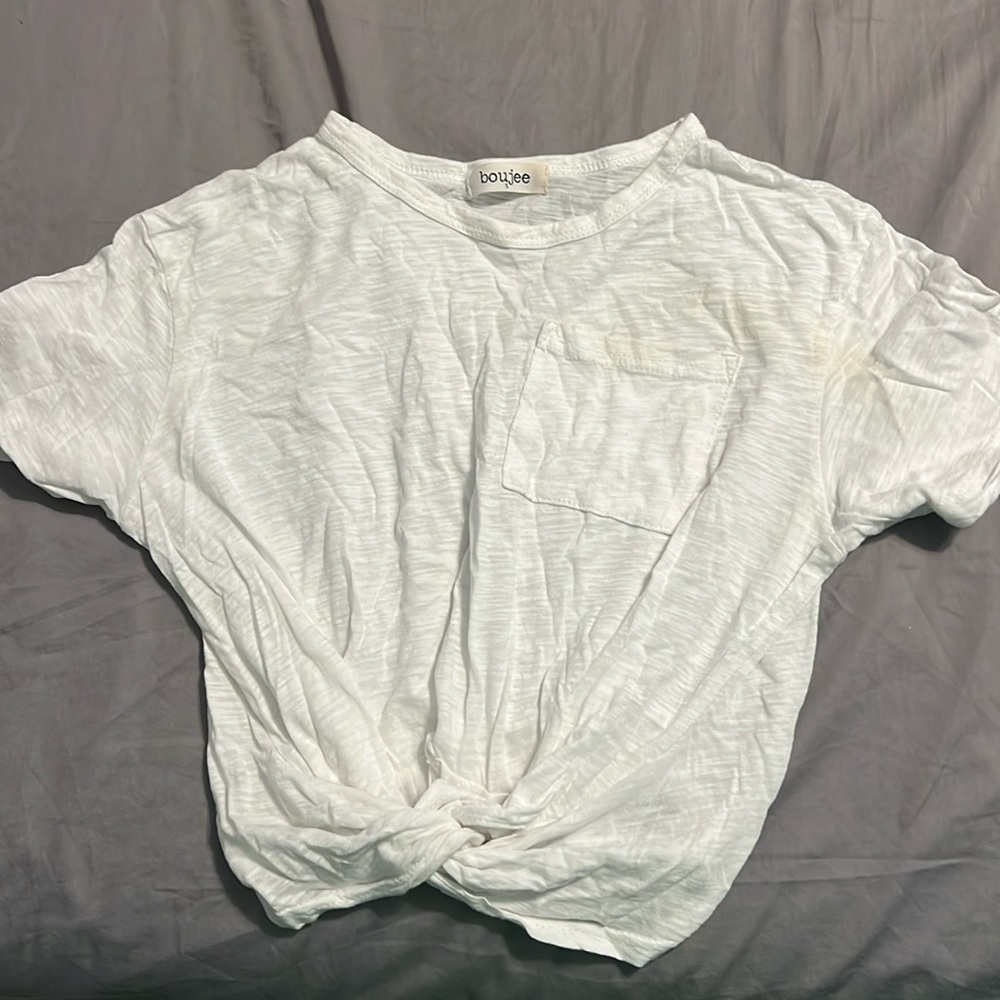 White top with knot at bottom.